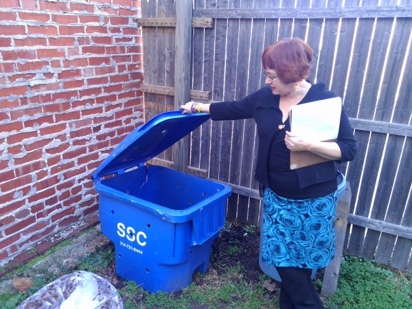 Owner of GDA-certified Urban Eats Cafe, Caya, shows off her home-made composting set up during the audit process.