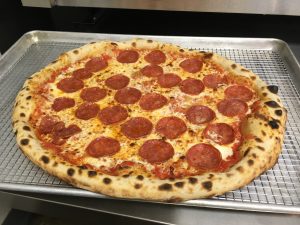 Sourdough crust makes this New York style pizza stand out from the competition.